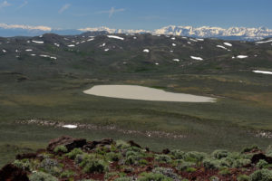 Scenic view of Beauty Peak East Pond with Sierra Nevada in distance