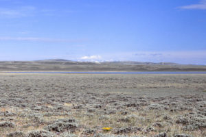 Scenic view of "Coyote Lake" 1987-05-16, #1609, with Wind River Mountains in distance; has fairy shrimp; Lander BLM Office