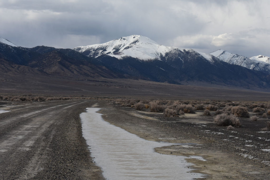 Scenic view of West Northumberland Road Pond #5 2019-03-19, #05, with Bunker Hill in distance; has fairy shrimp; Mount Lewis BLM Office