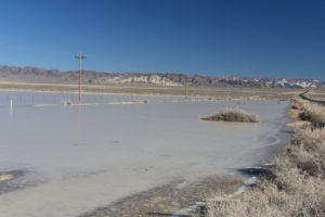 Scenic view of Labou Playa North Pond 2022-01-31, #01, with Chalk Mountain in distance; ice but no fairy shrimp; Stillwater BLM Office