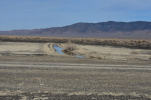 Scenic view of West Northumberland Road Pond #8 2022-03-01, #17, with Toquima Range in distance; lacks fairy shrimp; Mount Lewis BLM Office