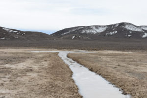 Scenic view of Win Wan Flat West Pond 2022-03-17, #01, with Gabbs Valley Range in the distance; has ice and fairy shrimp; Stillwater BLM Office