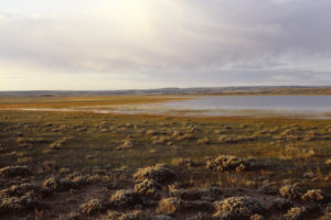 Scenic view of "Coyote Lake" 1987-06-06, #1905, at sunrise; has fairy shrimp; Lander BLM Office