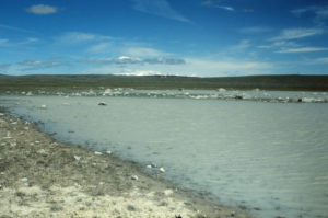 Scenic view of Northeastern "Lewiston Lake", 1993-06-10, #0423, with Wind River Mountains in distance; has fairy shrimp; private?, Lander BLM Office?