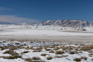 Scenic view of Teels Marsh Playa Lake 2022-01-14, #01, with Sierra Nevada on the horizon; snow; Stillwater BLM Office