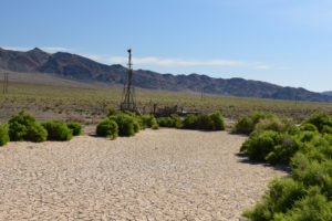 Scenic view of Wrecked Windmill Pond 2019-05-18, #06, with wrecked windmill; dry; Stillwater BLM Office