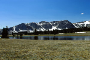 Scenic view of Libby Flats Overlook Pond 1989-07-05, #0635; has fairy shrimp, with cliffs of Snowy Range; Laramie Ranger District, Medicine Bow-Routt National Forest