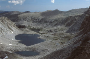 Scenic view of Stough Below the Moraine Pond 1985-07, #1112, and upper Stough Creek Canyon with Canyon Lake and Blackrock Lake; lacks fairy shrimp; Lander Ranger District, Shoshone National Forest, Popo Agie Wilderness