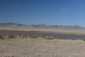 Scenic view of East Stone Cabin Lower Reservoir 2023-04-16, #08, with Hot Creek Range in distance; lacks fairy shrimp; Tonopah BLM Office