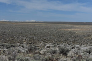 Scenic view of Owyhee Middle Dry Lake 2023-04-29, #83, with Santa Rosa Range in distance; dry; Tuscarora BLM Office