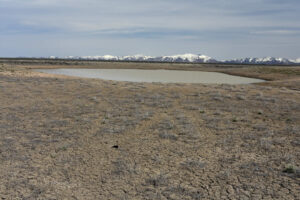 Scenic view of "Silver Lake" 2023-04-27, #23, with Bull Run Mountains in distance; has fairy shrimp; Tuscarora BLM Office