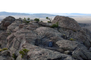 Scenic view of Half Moon Rock Pool 2025-08-17, #11, with Long Creek Mountain; dry; Lander BLM Office